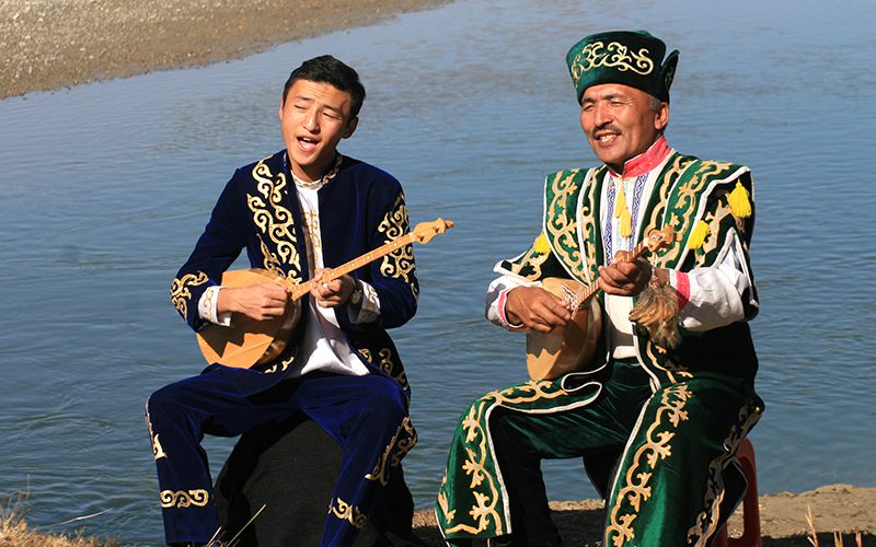 MN - Bayan-Ulgii - GEF - Performers on River Shore - Close Up - copyright - Bruce Belcher
