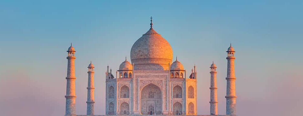 Taj Mahal in India with Sun Setting in Background